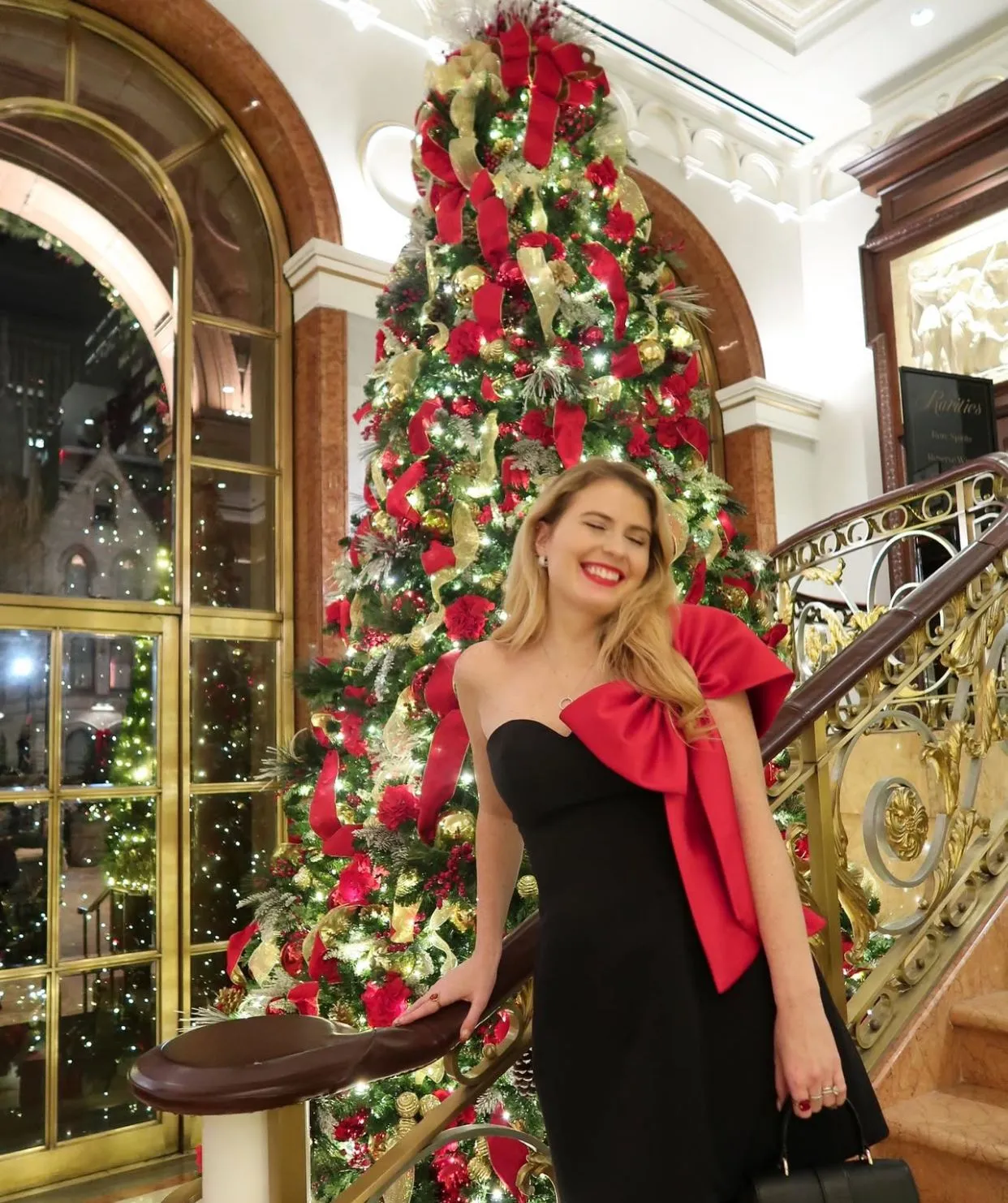 Elegant Off-Shoulder Dress with Dramatic Red Bow Accent